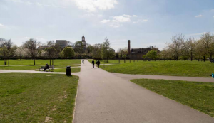 View across Burgess Park with proposed new development to the left St George's church