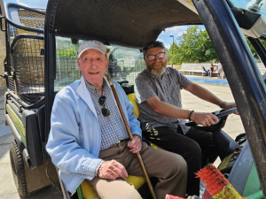 Photo of David Sadler in a park keeper's buggy