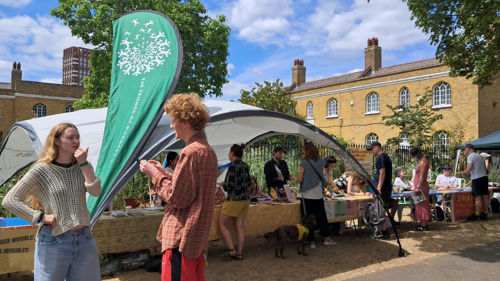 Making our Neighbourhood event showing FOBP banner and stall and people at the event.