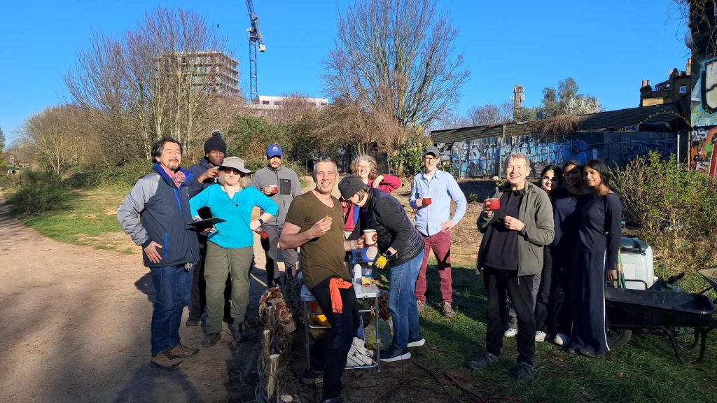 Group of people together at Southampton Way entrance with refreshments at the end of the volunteer session.